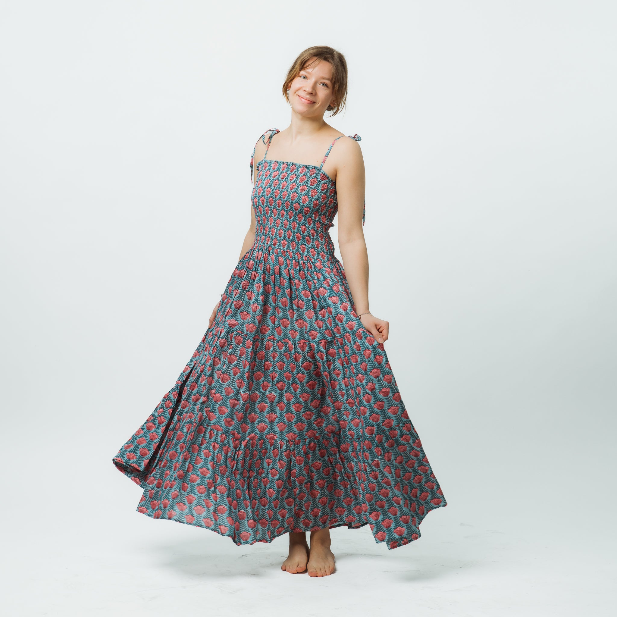 Woman wearing a floral dress on a white background