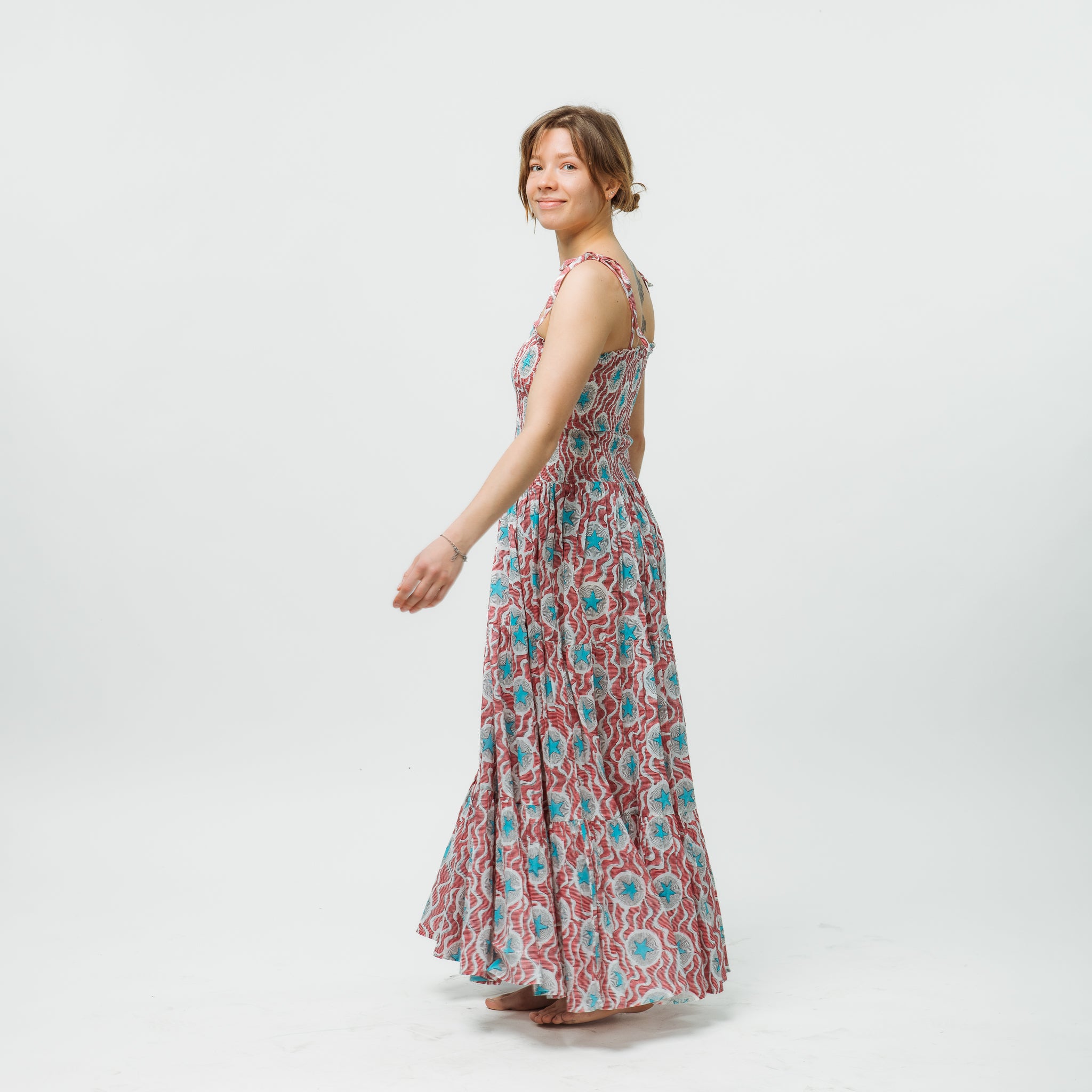 Woman wearing a floral dress on a white background