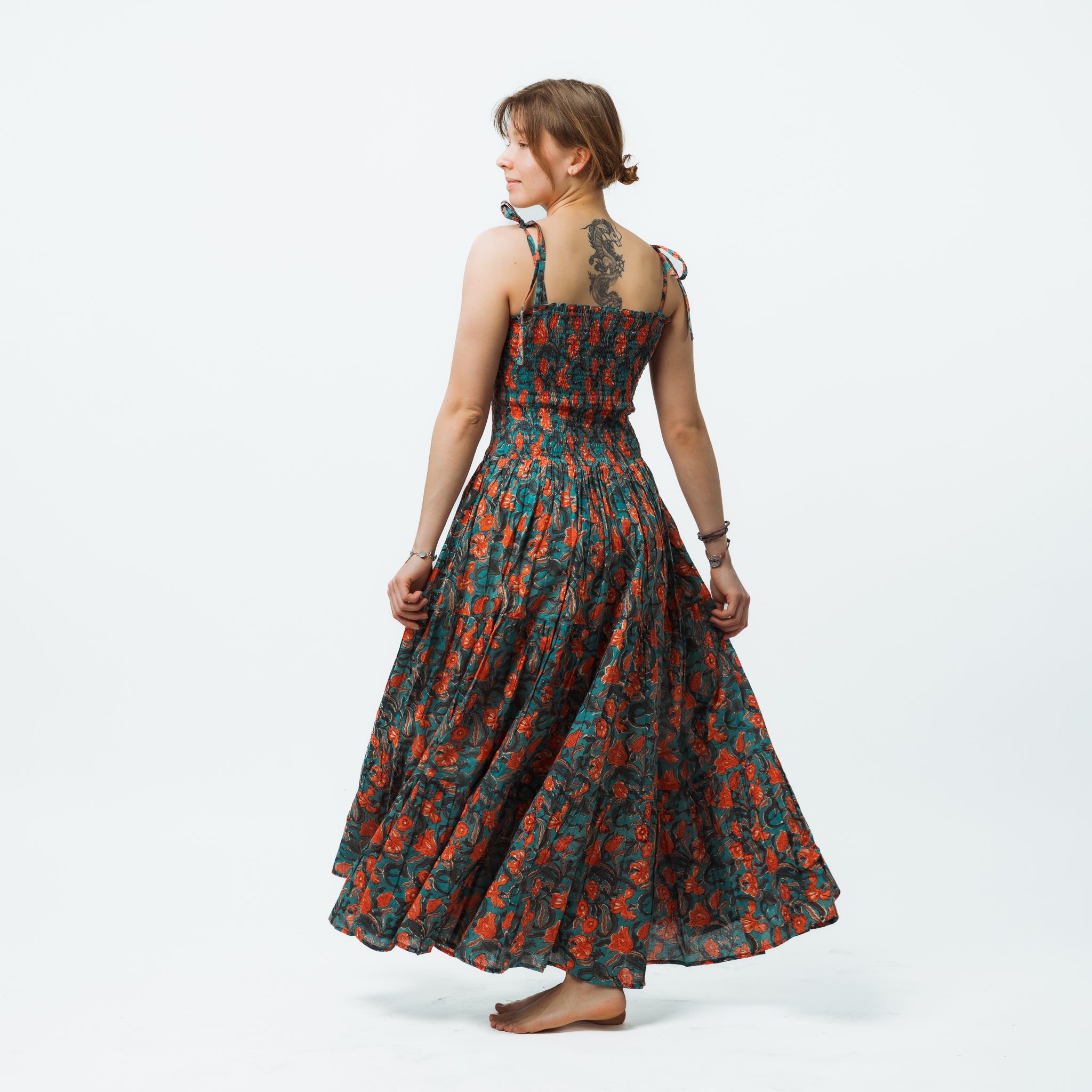 Woman wearing a floral dress on a white background