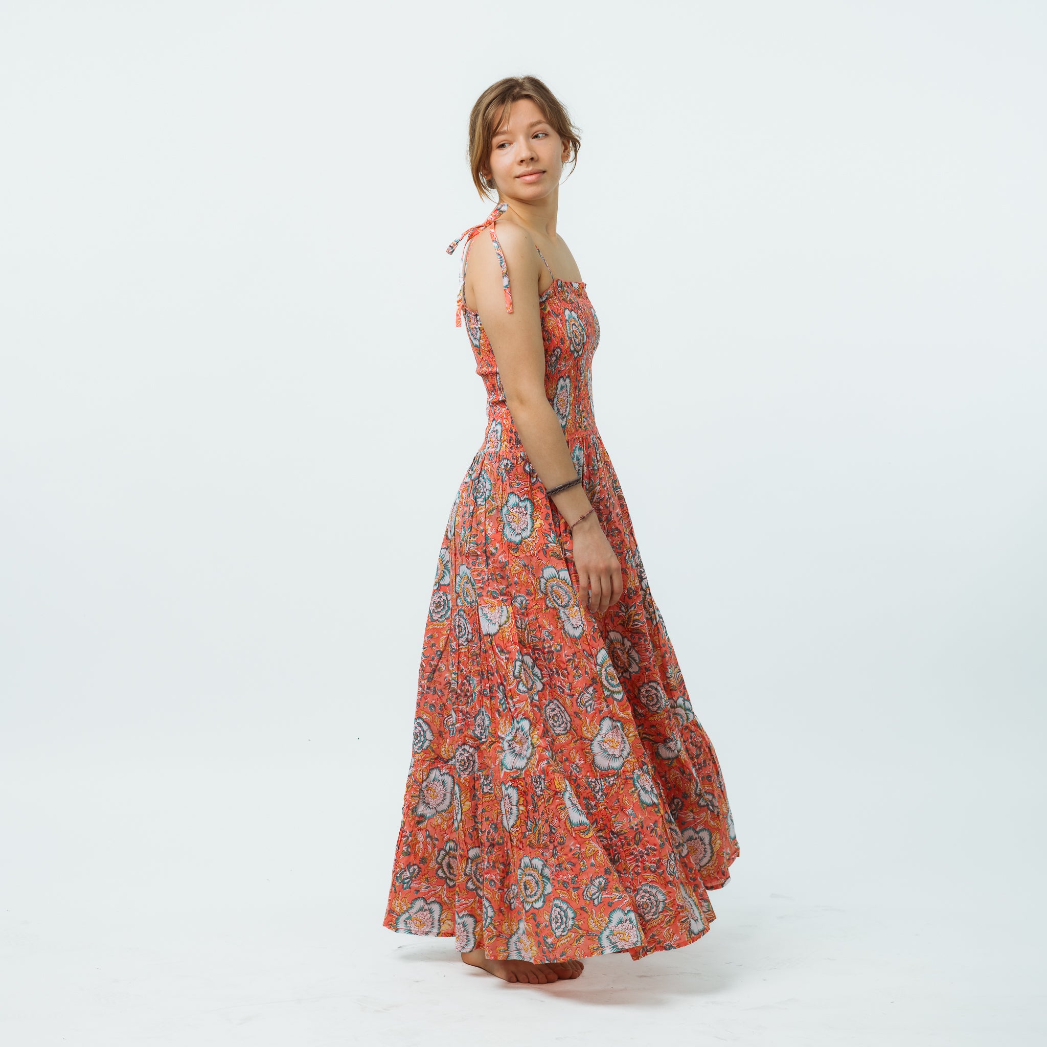 Woman wearing a floral dress on a white background