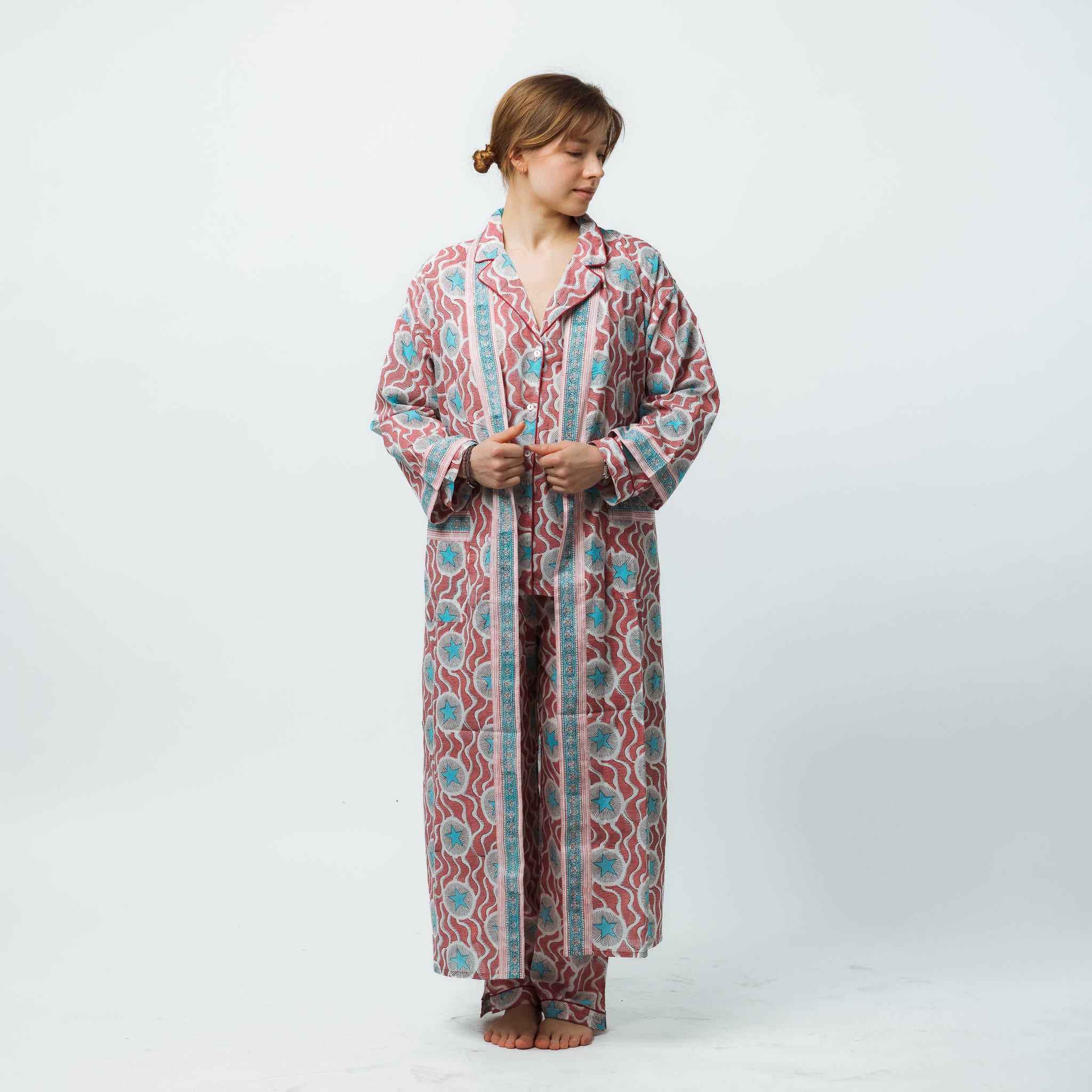 Woman wearing a patterned robe on a white background