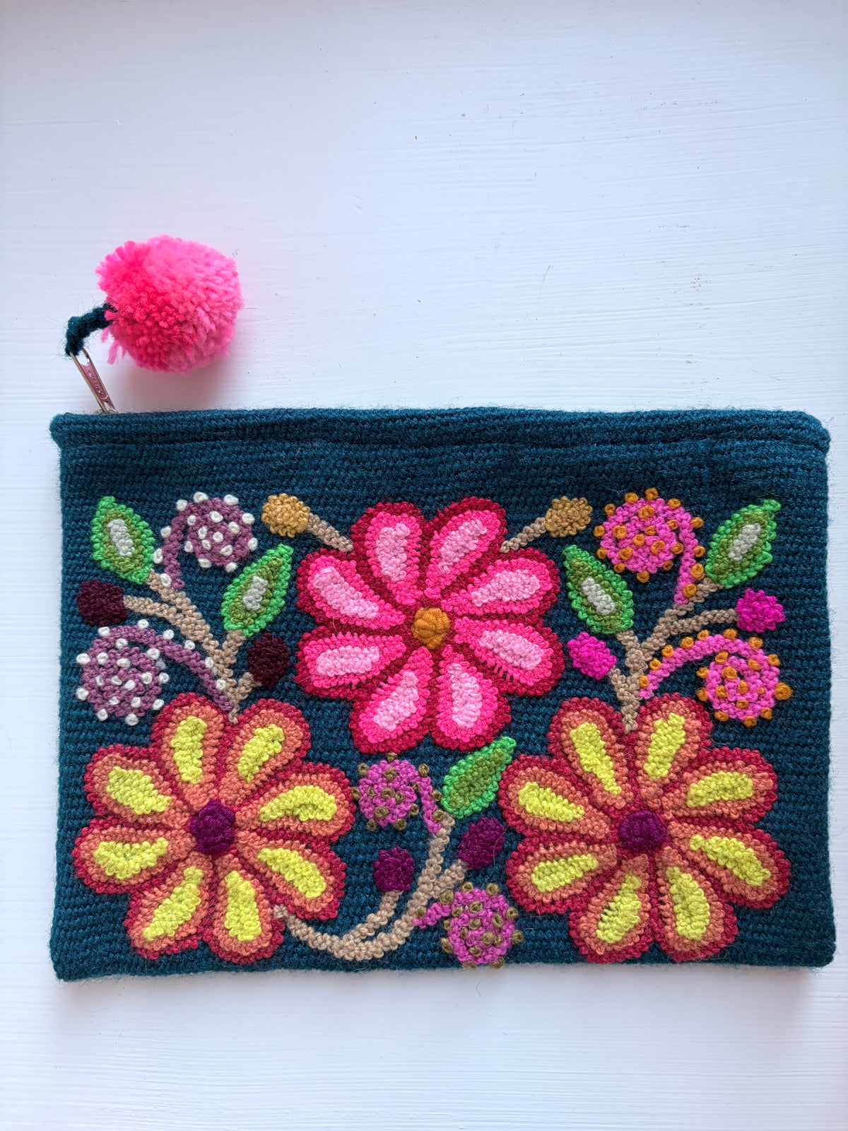blue pouch with colorful flowers