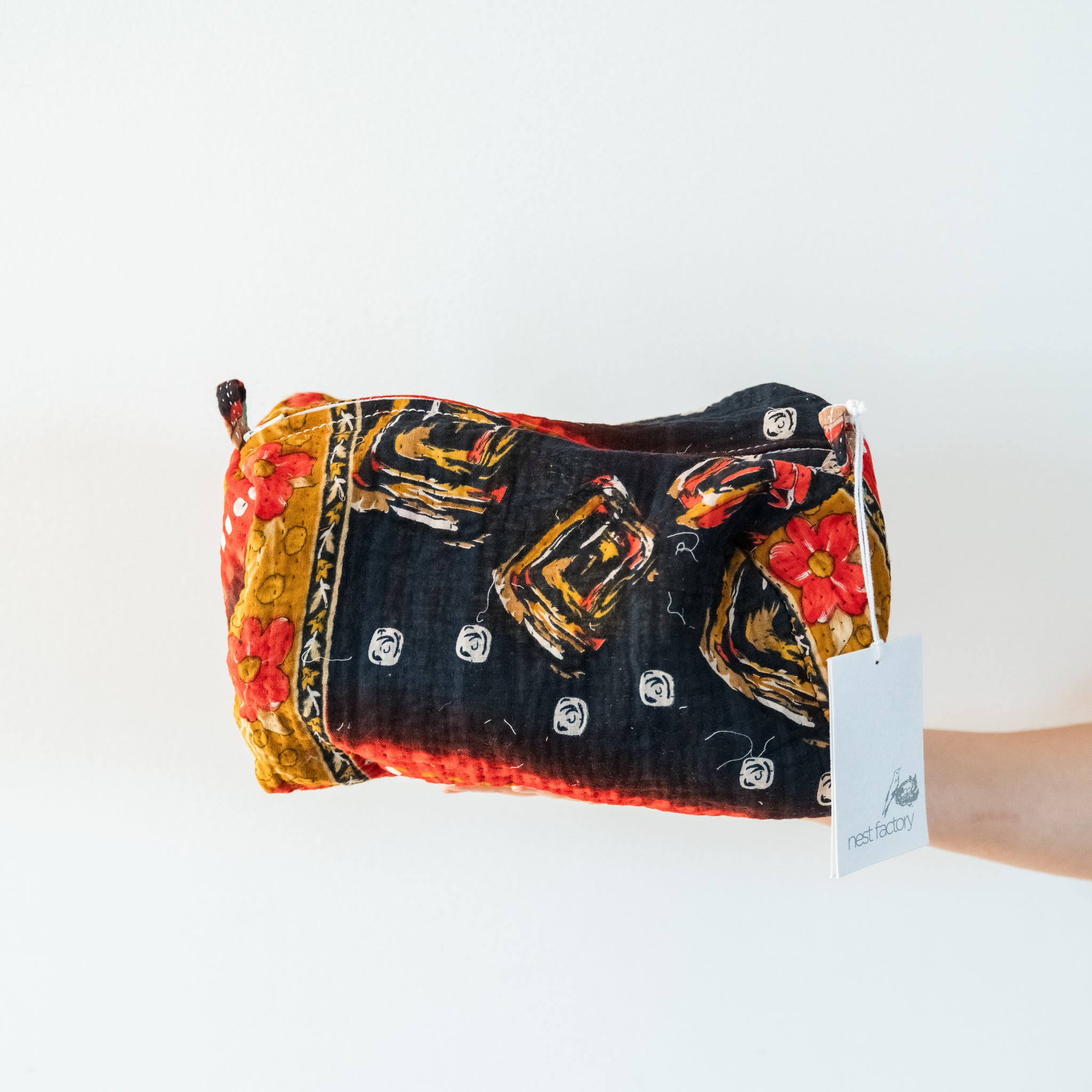 Makeup Bag with colorful pattern on a white background.