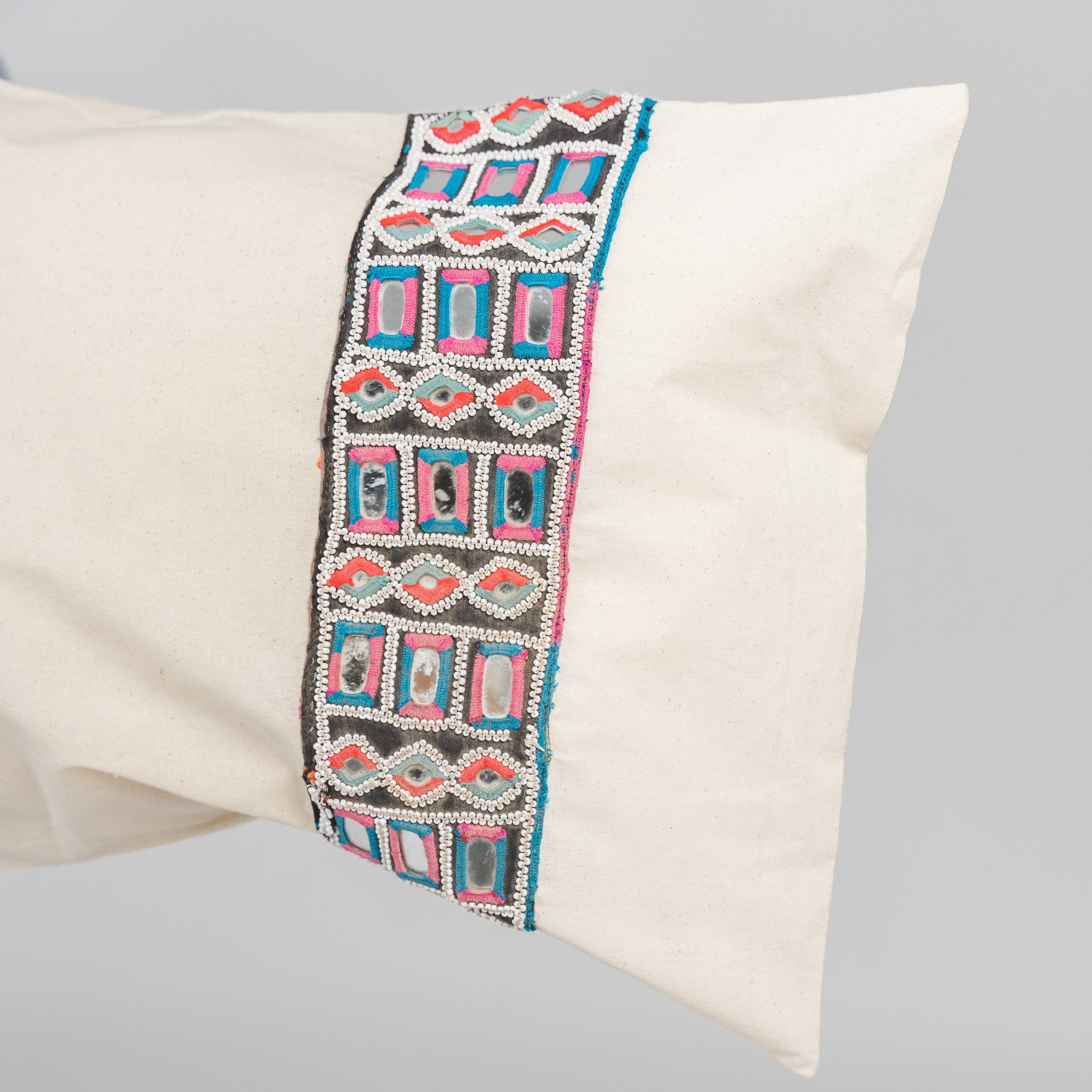 bespoke pillows with vintage embroidered trims