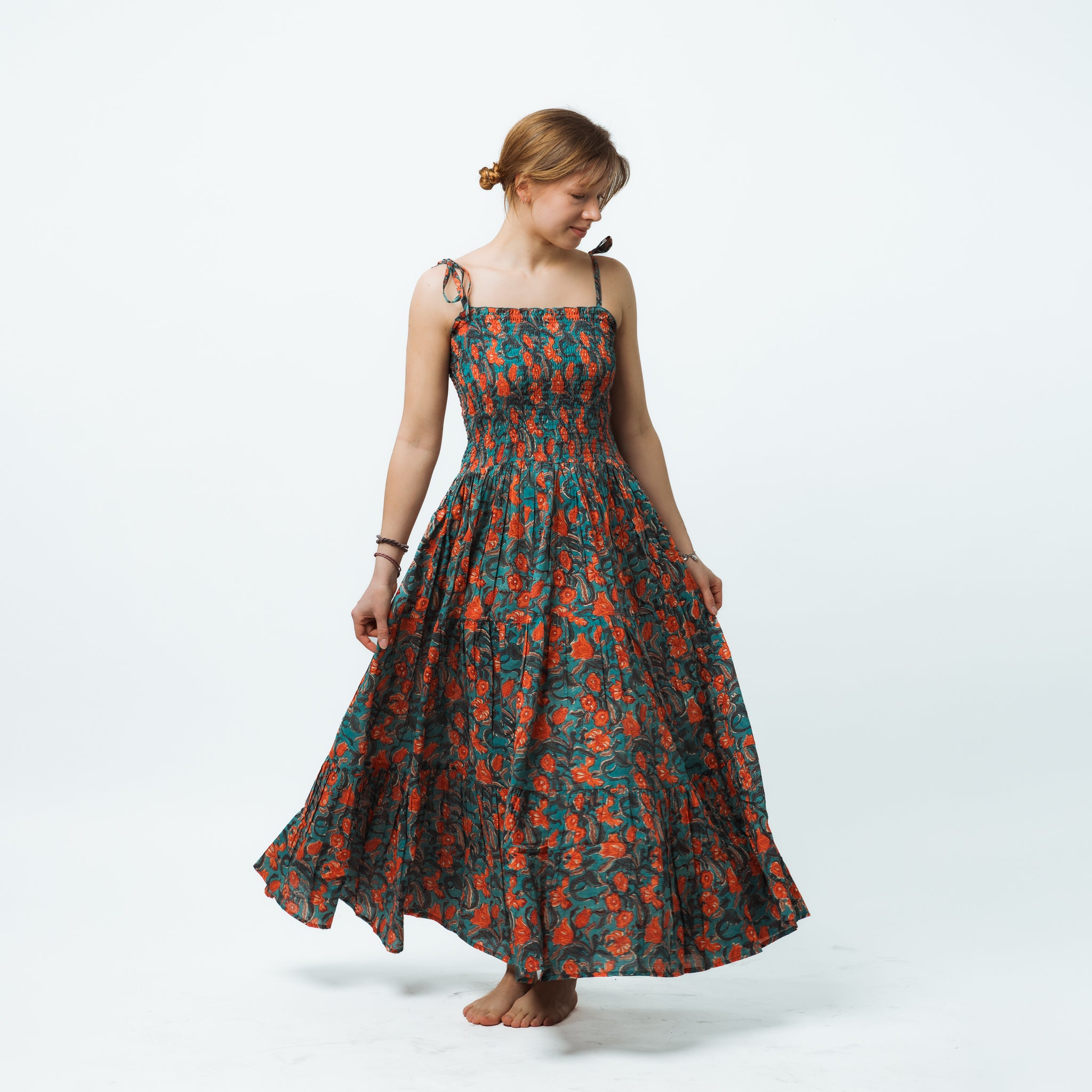 Woman wearing a floral dress on a white background