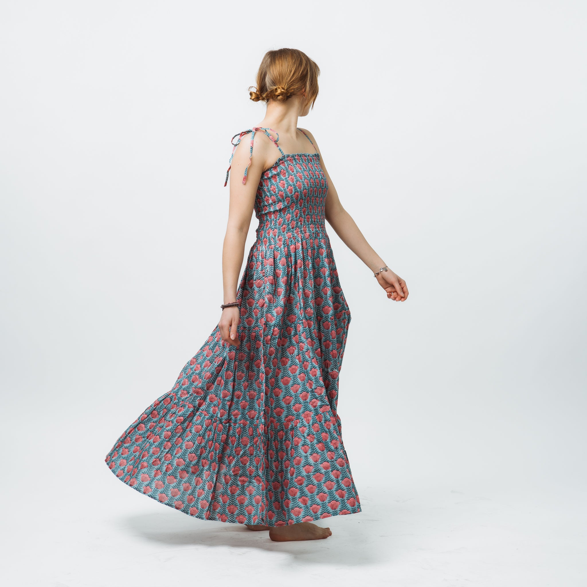 Woman wearing a floral dress on a white background