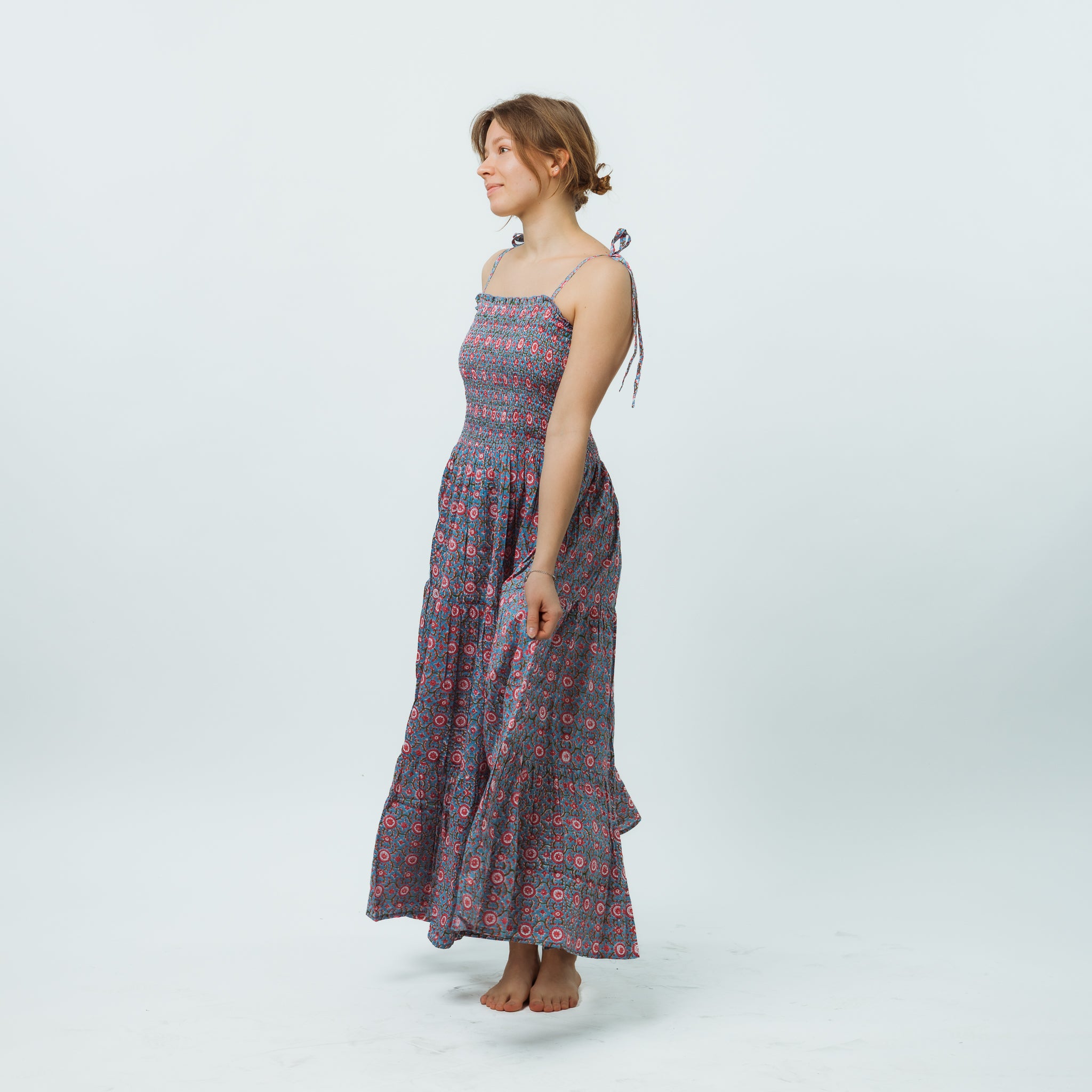 Woman wearing a floral dress on a white background