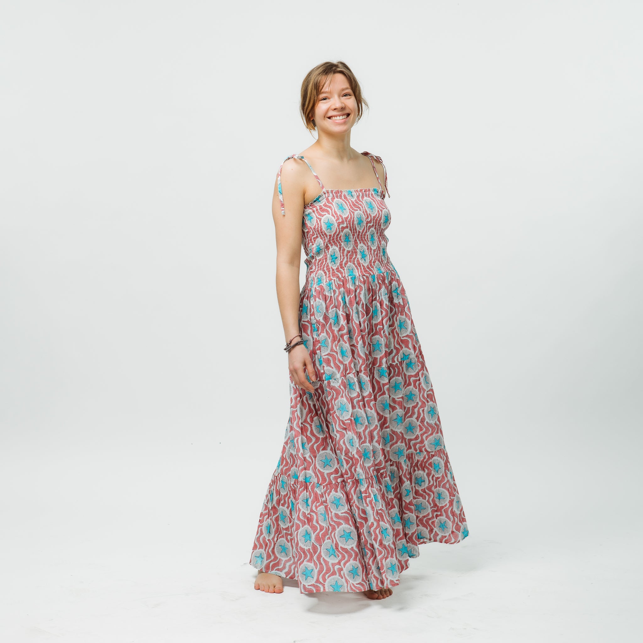 Woman wearing a floral dress on a white background