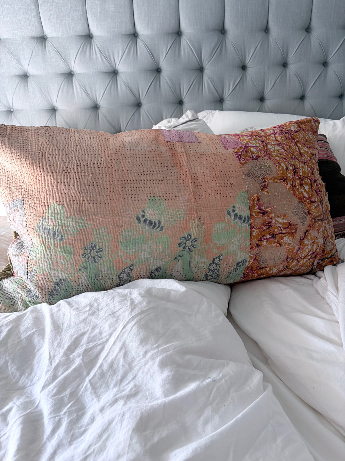 patched pillow on bed